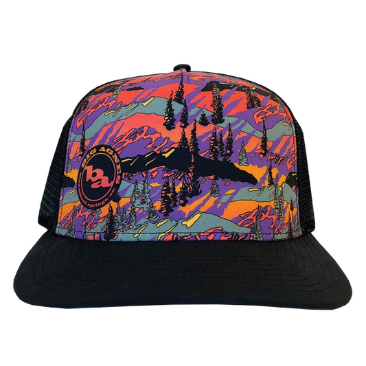 Colorful cap with mountain and forest design on a white background