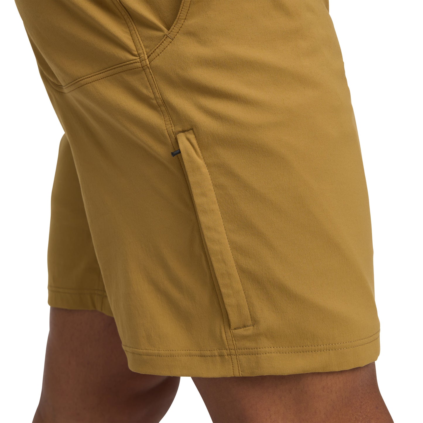Close-up of mustard yellow shorts on a white background