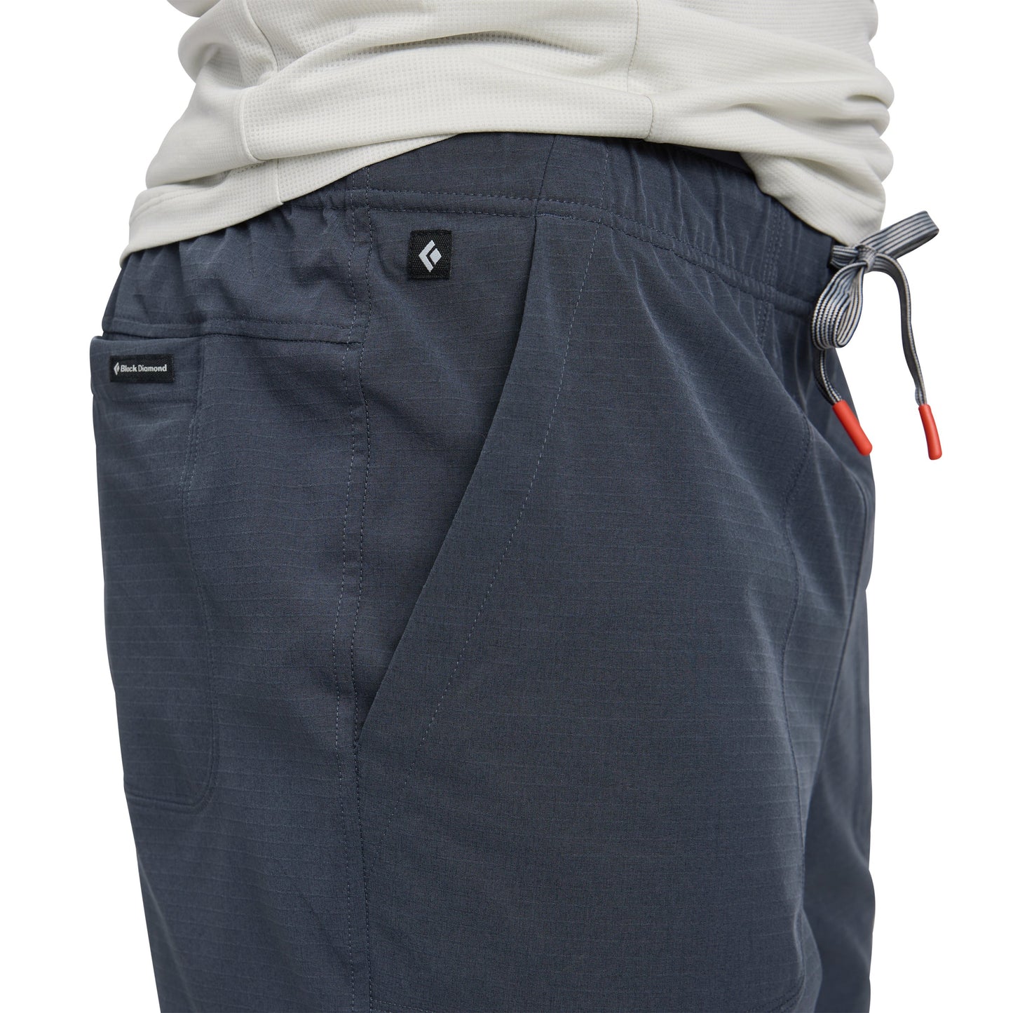 Dark gray pants with a brand logo on a white background