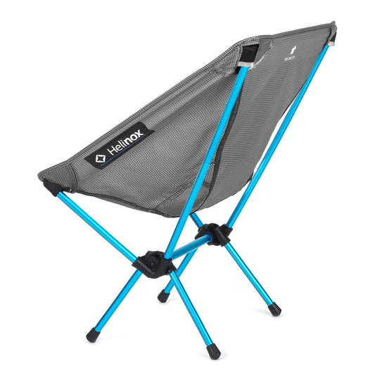 Helinox camping chair with blue legs on a white background