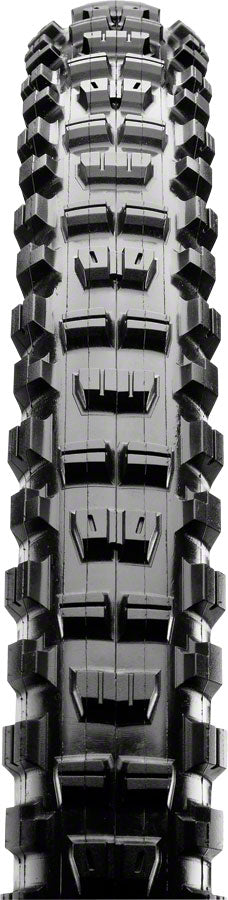 Close-up of a tire tread pattern with deep grooves and sipes