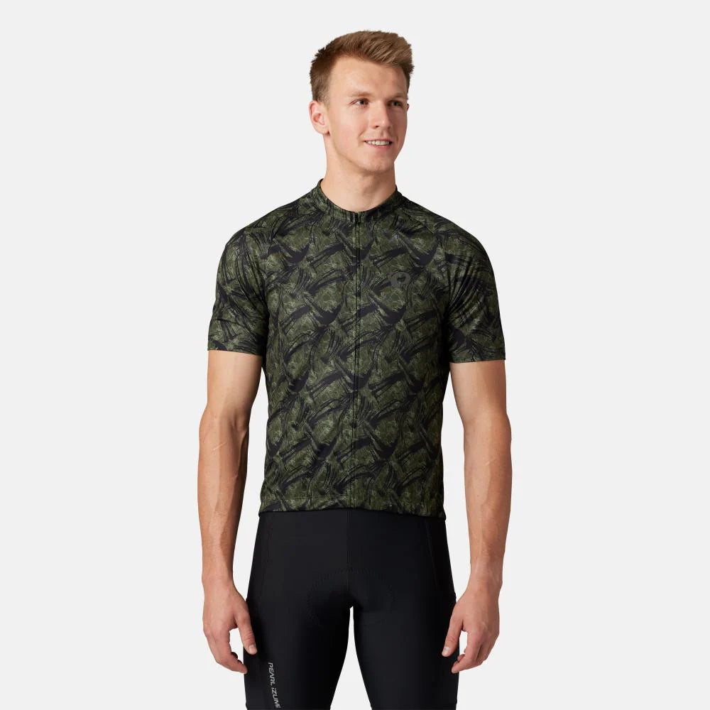 Man wearing a green camouflage cycling jersey on a white background