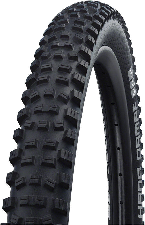 Close-up of a mountain bike tire with tread pattern on a white background