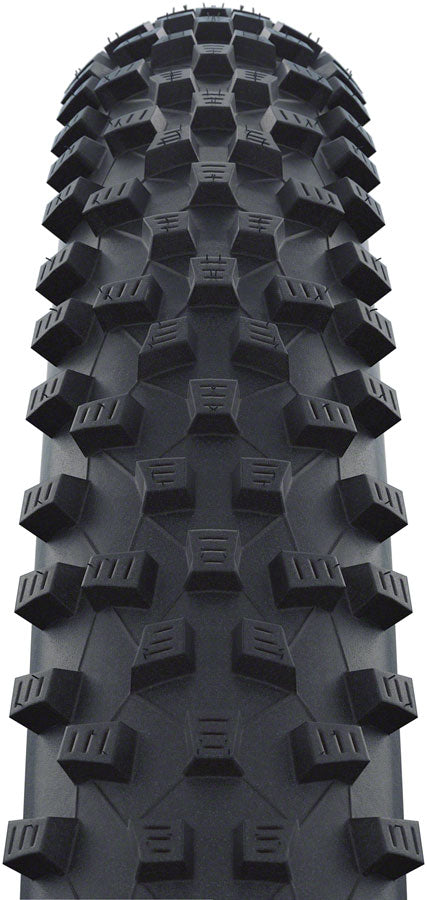 Close-up of a black off-road tire tread pattern on a white background