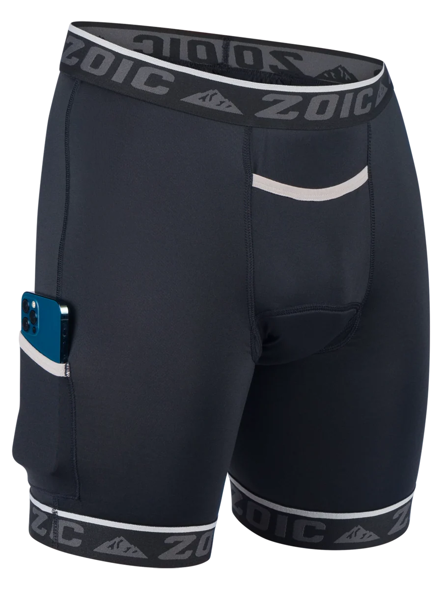 Black athletic shorts with white accents and 'Zoic' branding on a white background