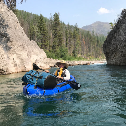 Arni Ronis packrafting on the South Fork of the Flathead in Montana