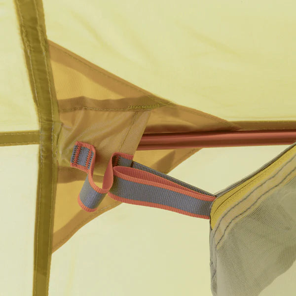 Close-up of a tent's mesh side with a zipper and strap detail.
