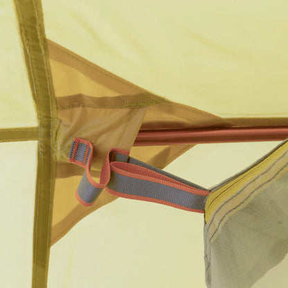 Close-up of a tent's mesh side with a zipper and strap detail.