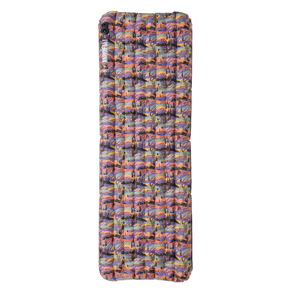 Multicolored inflatable camping mattress on a white background