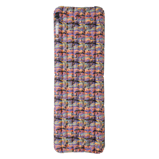 Multicolored inflatable camping mattress on a white background