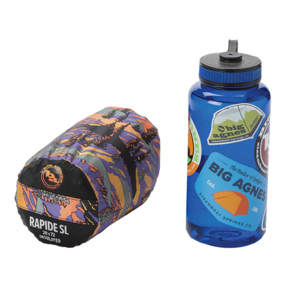 Multicolored sleeping bag and blue water bottle with Big Agnes logo on a white background