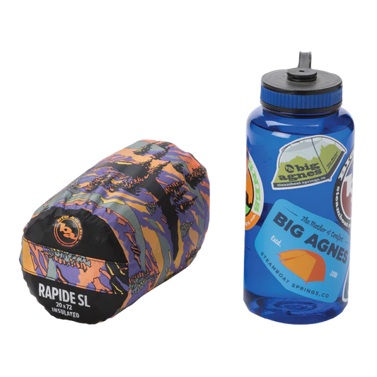 Multicolored sleeping bag and blue water bottle with Big Agnes logo on a white background
