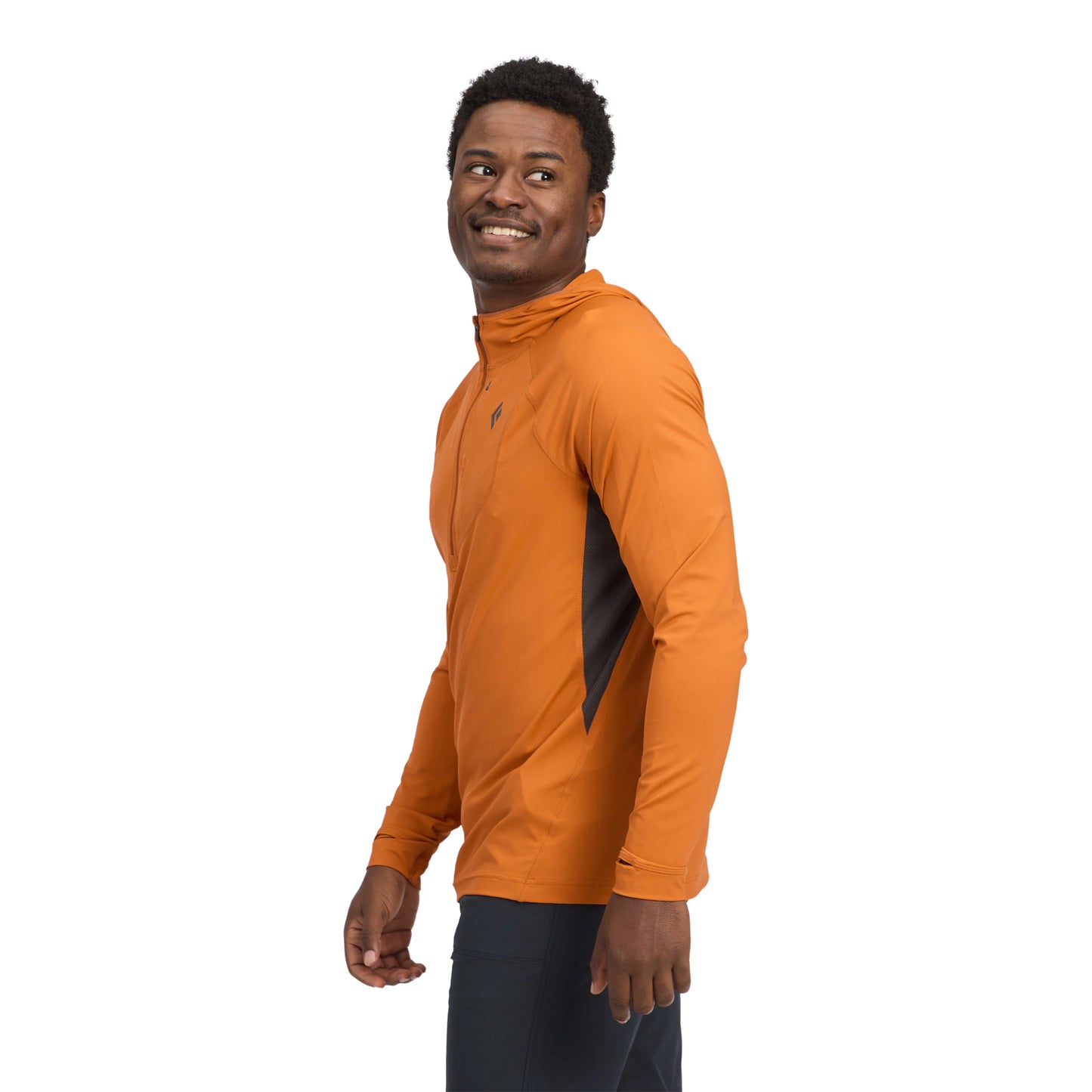 Man wearing an orange long-sleeve athletic shirt on a white background