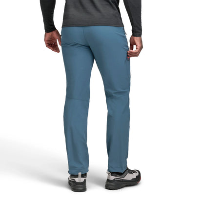 Blue pants worn by a person on a white background