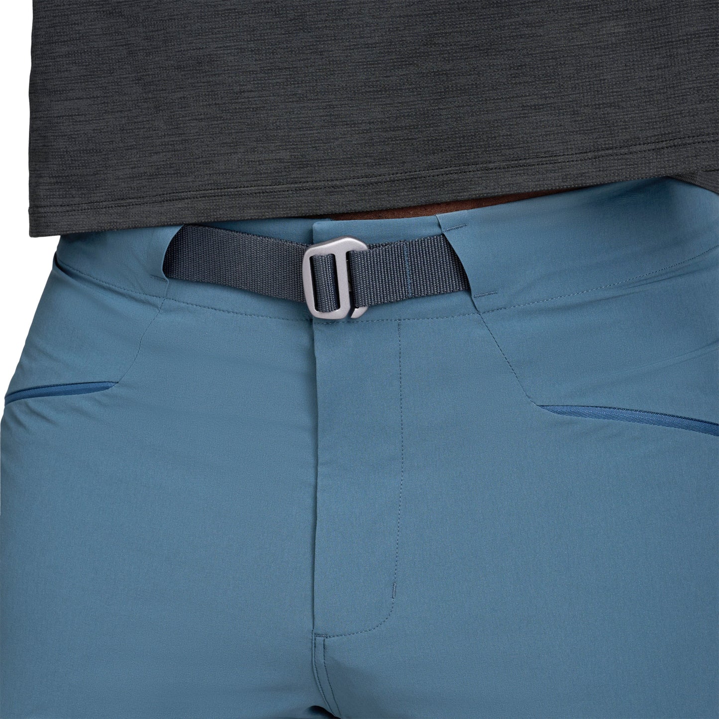 Blue pants with a black belt and buckle, worn by a person.