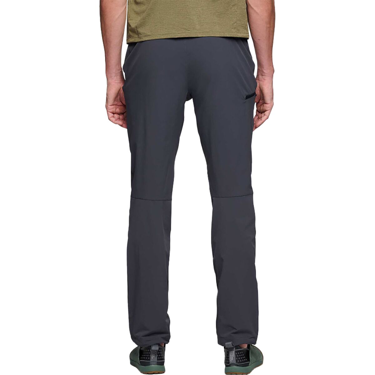 Dark gray pants worn by a person on a white background