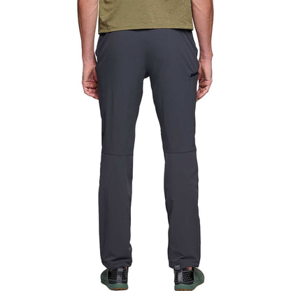 Dark gray pants worn by a person on a white background