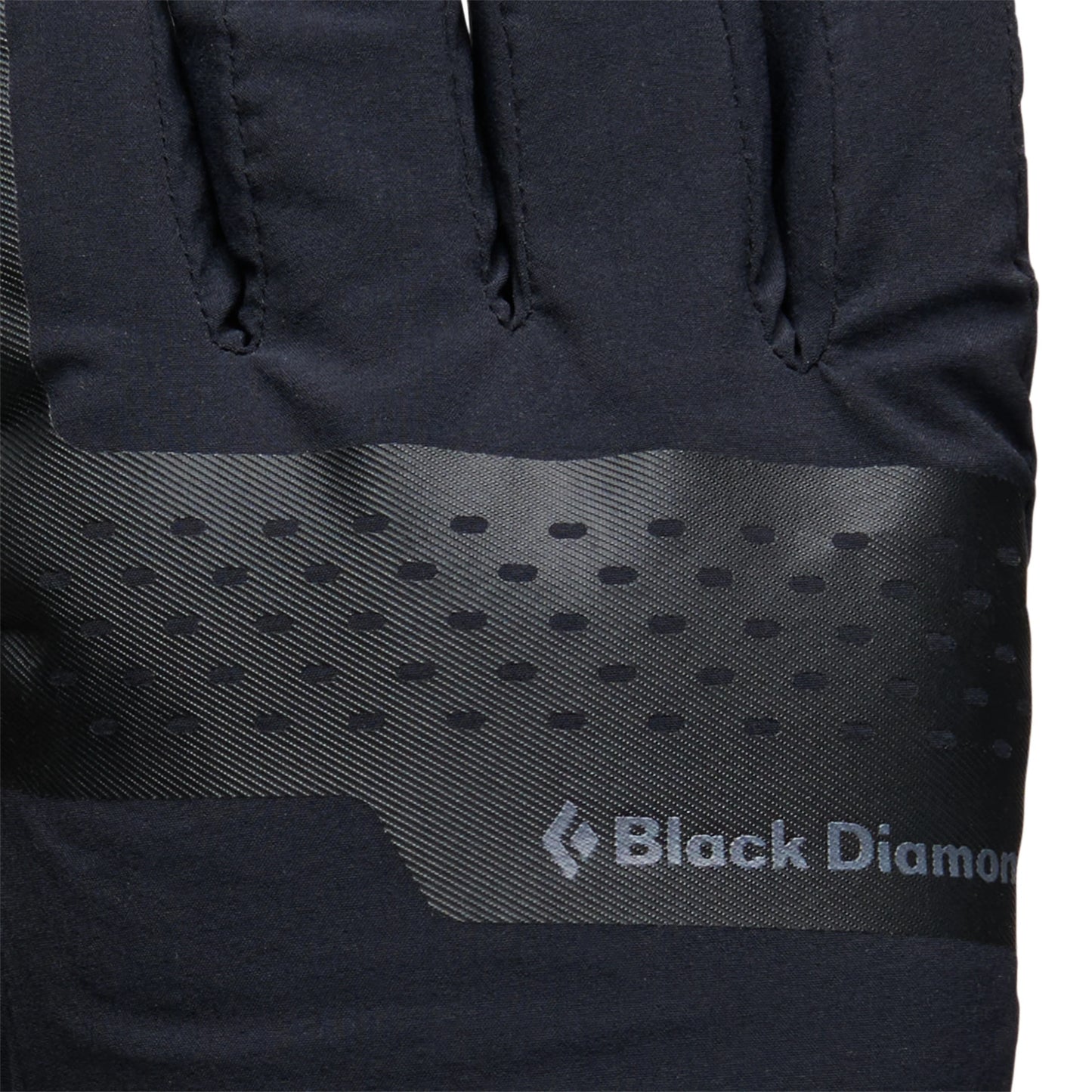 Close-up of a black jacket with Black Diamond logo on a white background