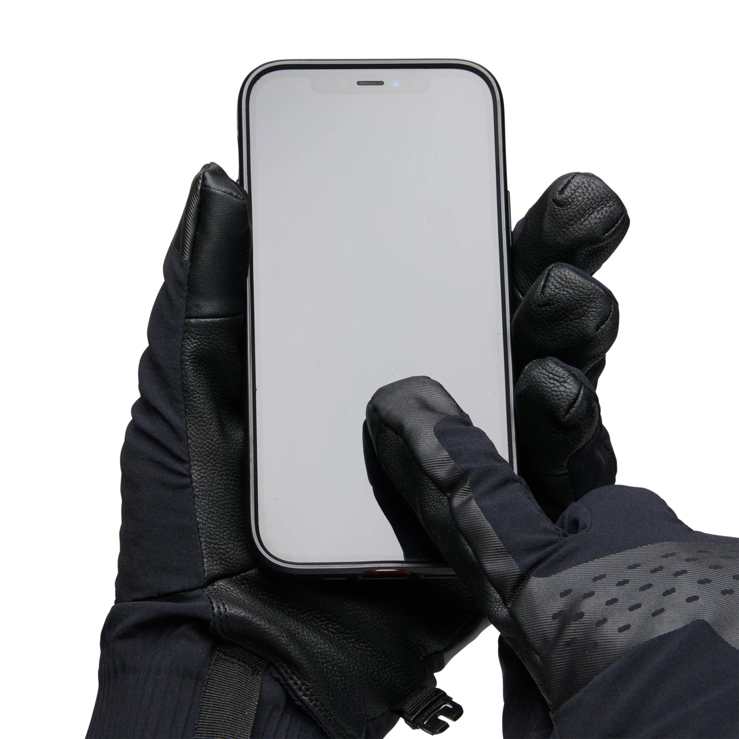 Person wearing black gloves holding a smartphone on a white background