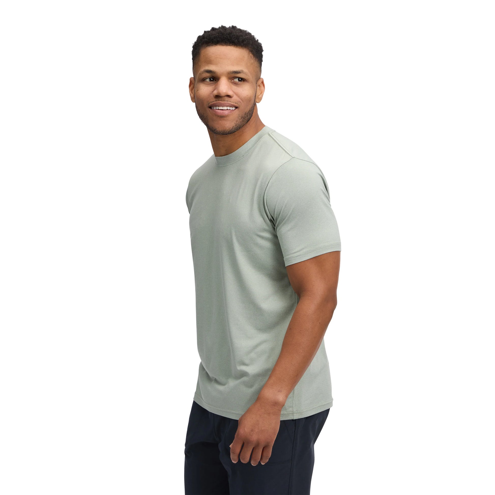 Man wearing a light green t-shirt on a white background