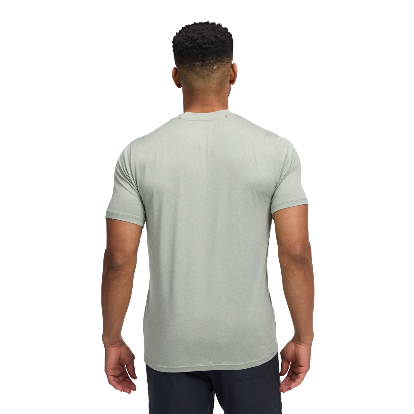 Man wearing a light green t-shirt on a white background
