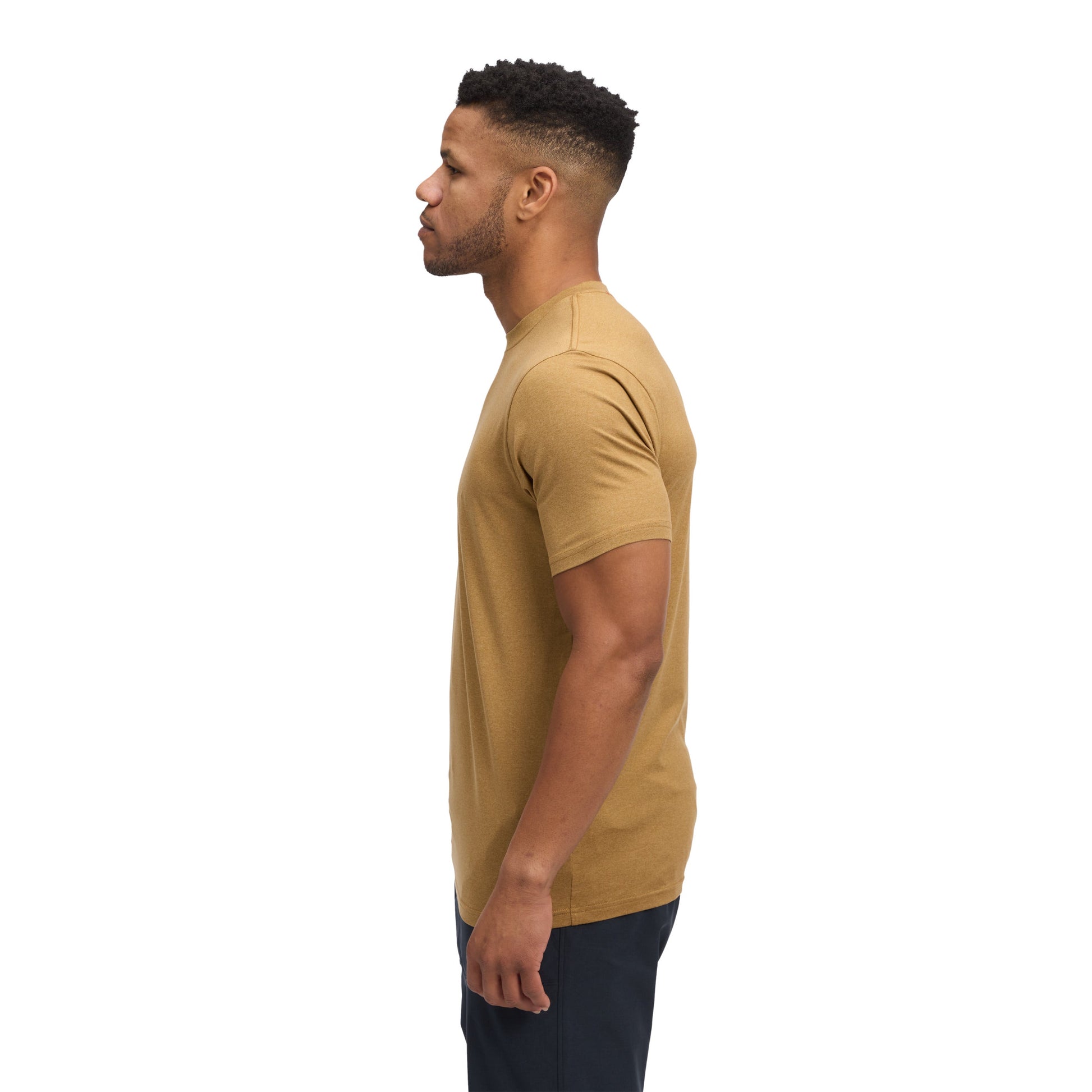 Man wearing a beige t-shirt on a white background