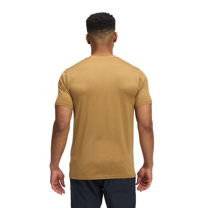 Man wearing a beige t-shirt on a white background