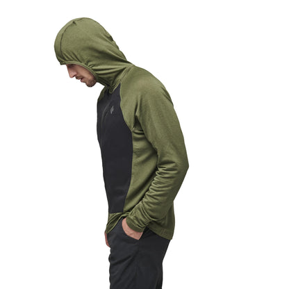 Person wearing a green and black hoodie on a white background