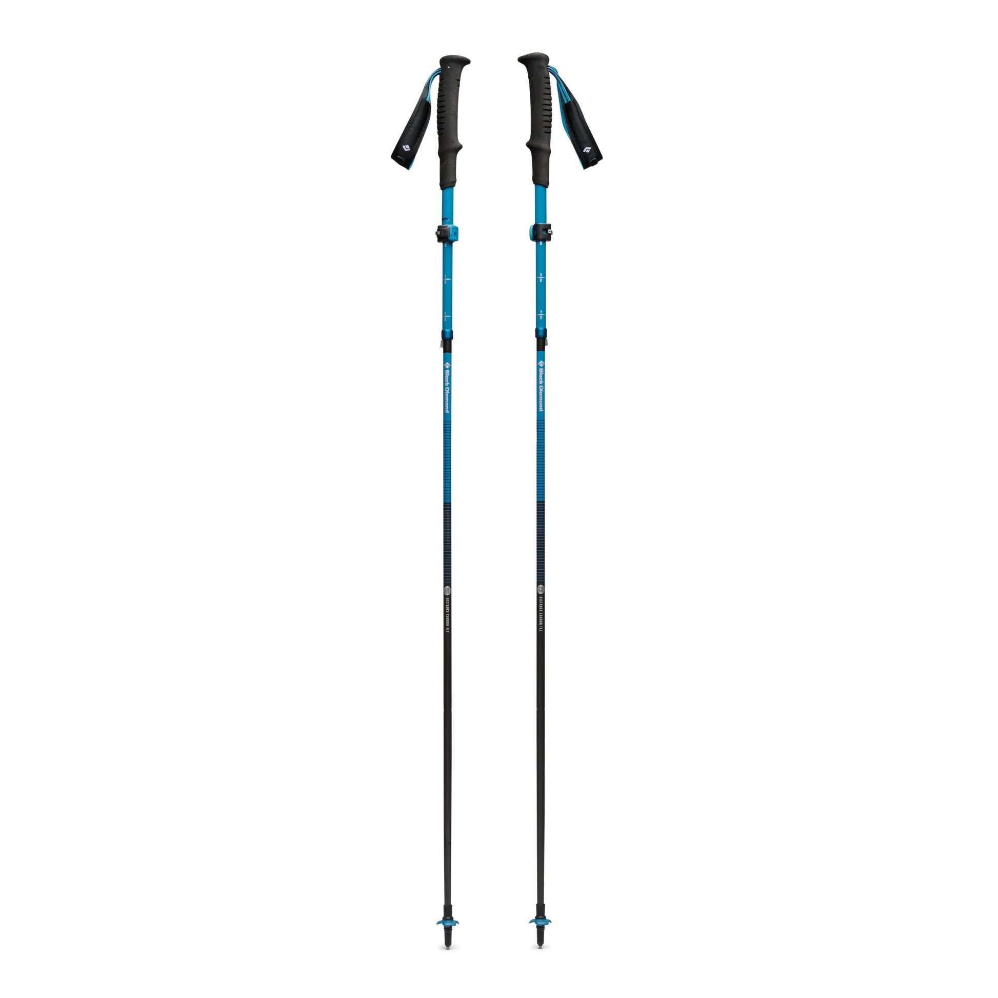 Two blue and black hiking poles on a white background
