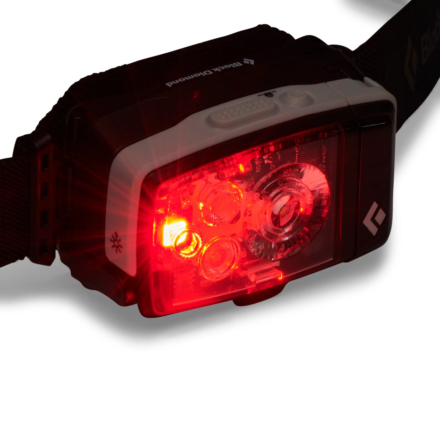 red LED of Black diamond headlamp on white background