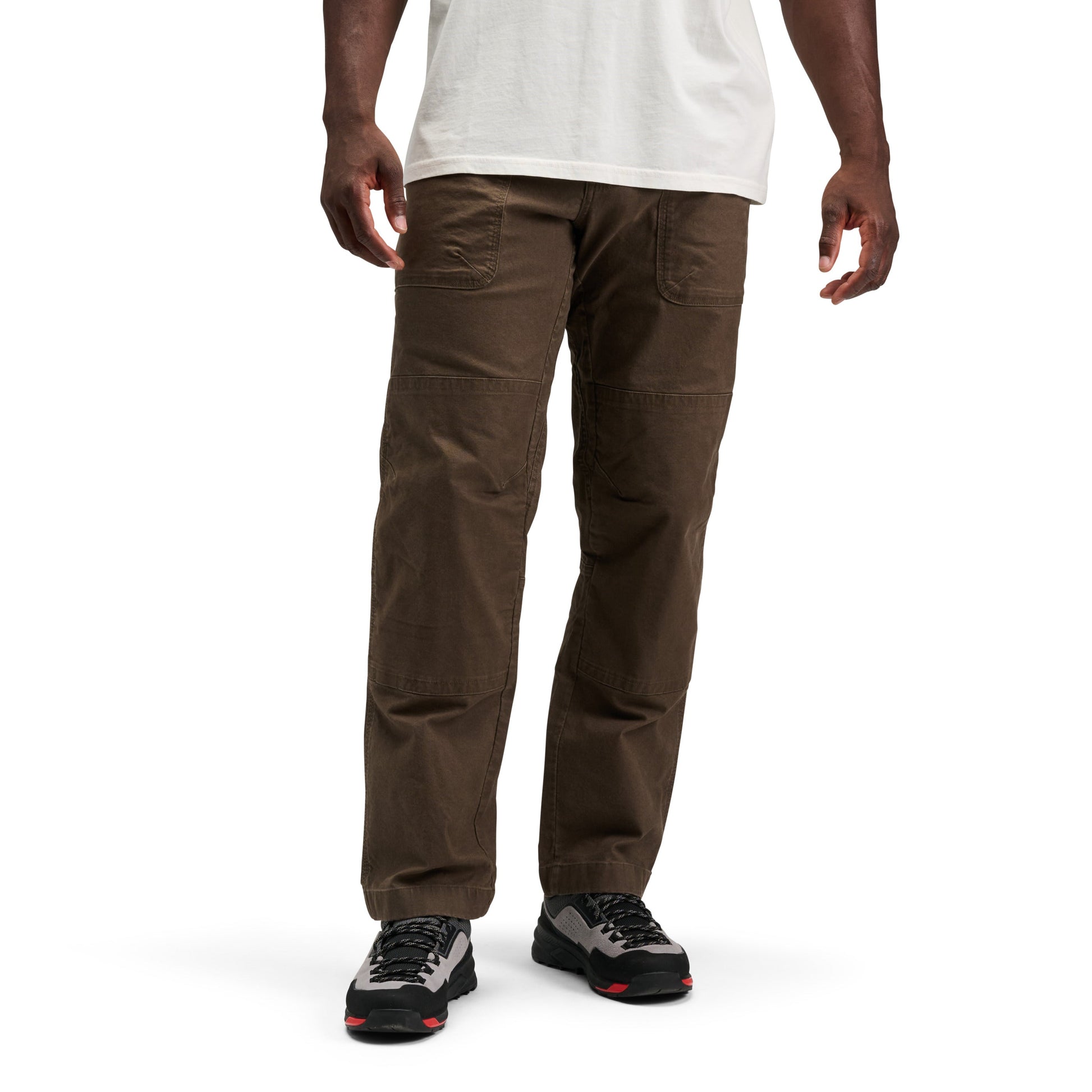 Person wearing brown pants on a white background