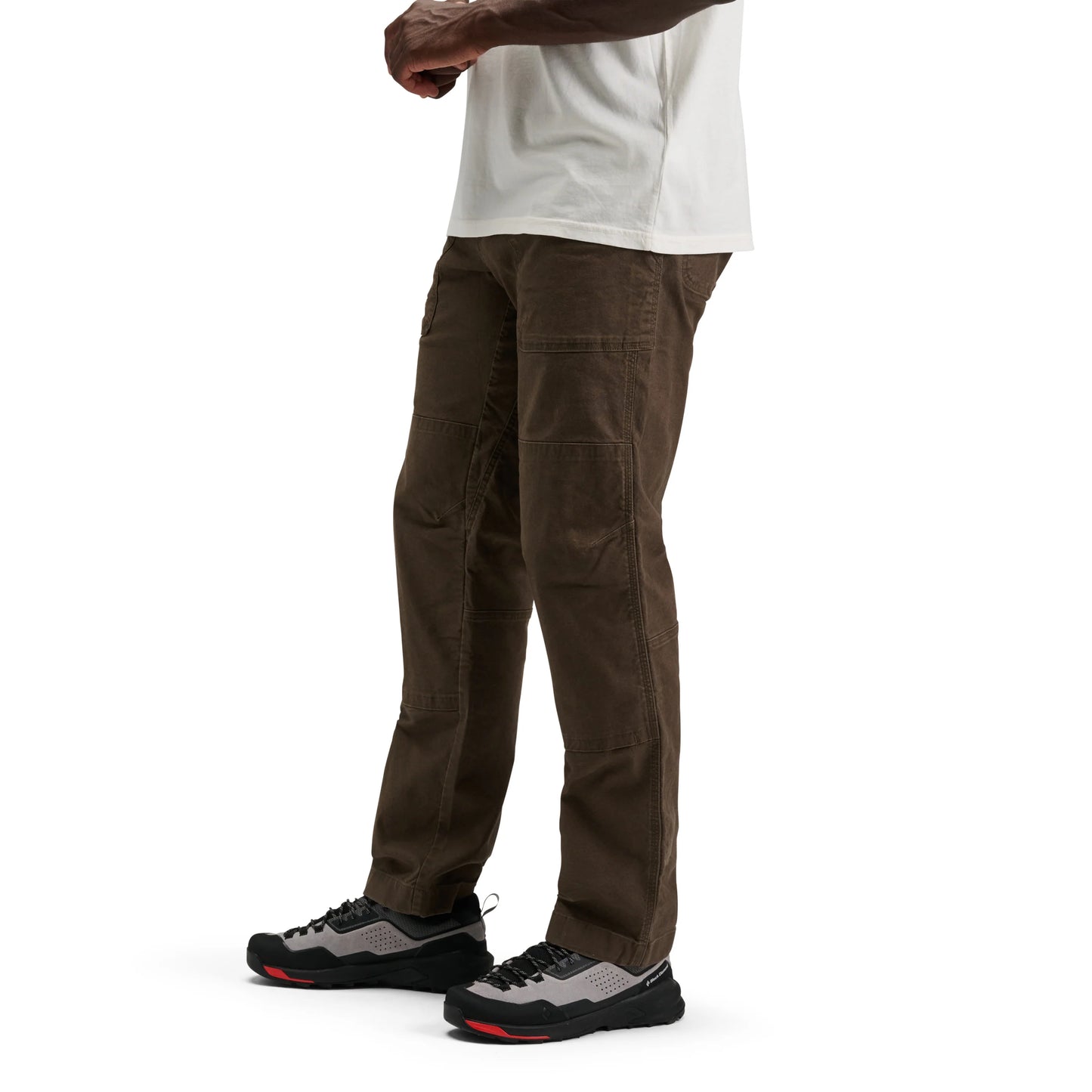 Brown cargo pants worn by a person on a white background