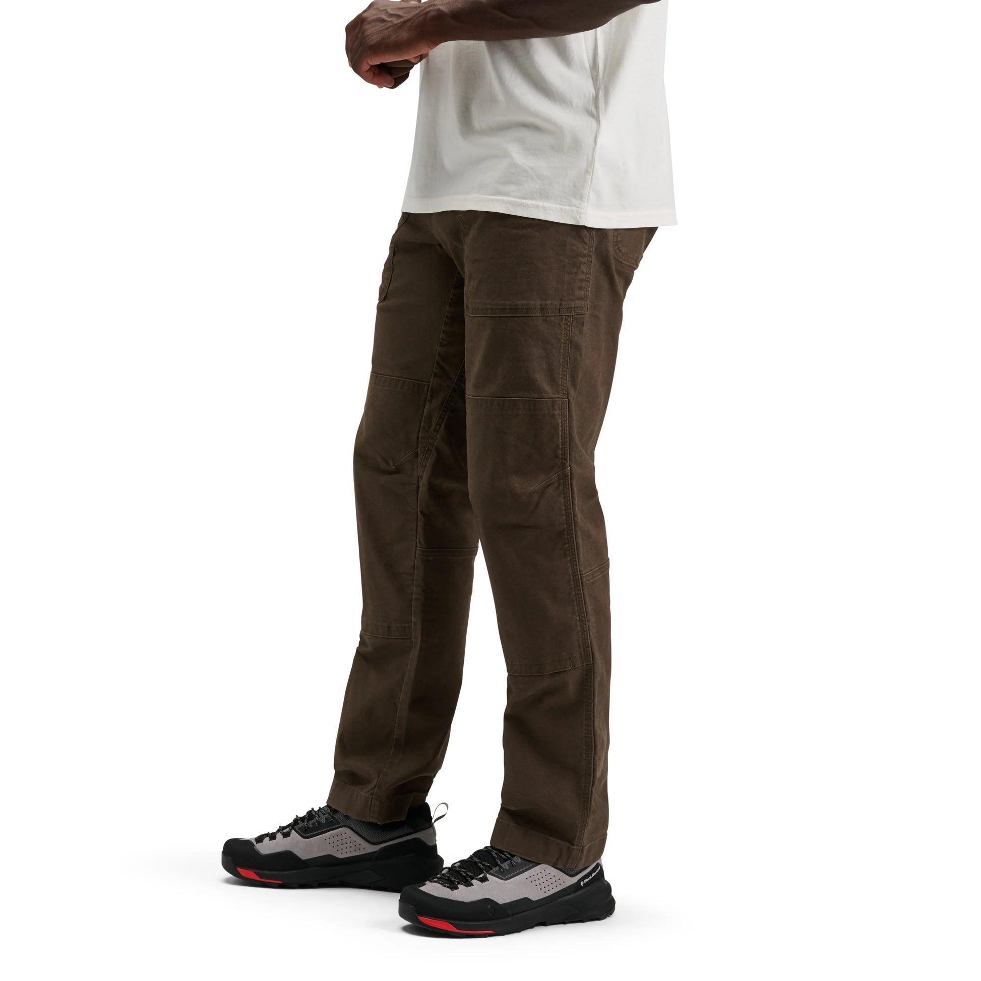 Brown cargo pants worn by a person on a white background