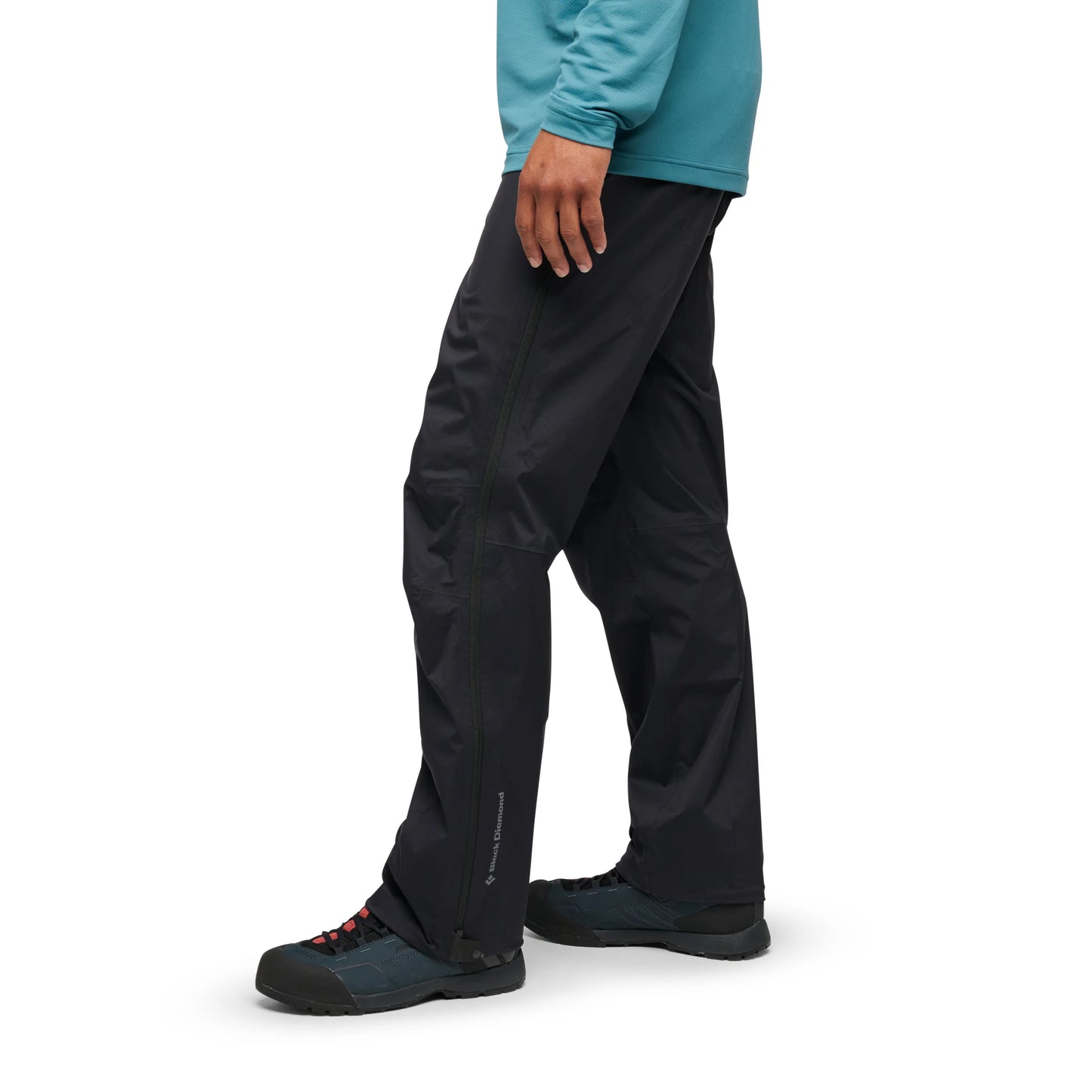 Person wearing black pants on a white background