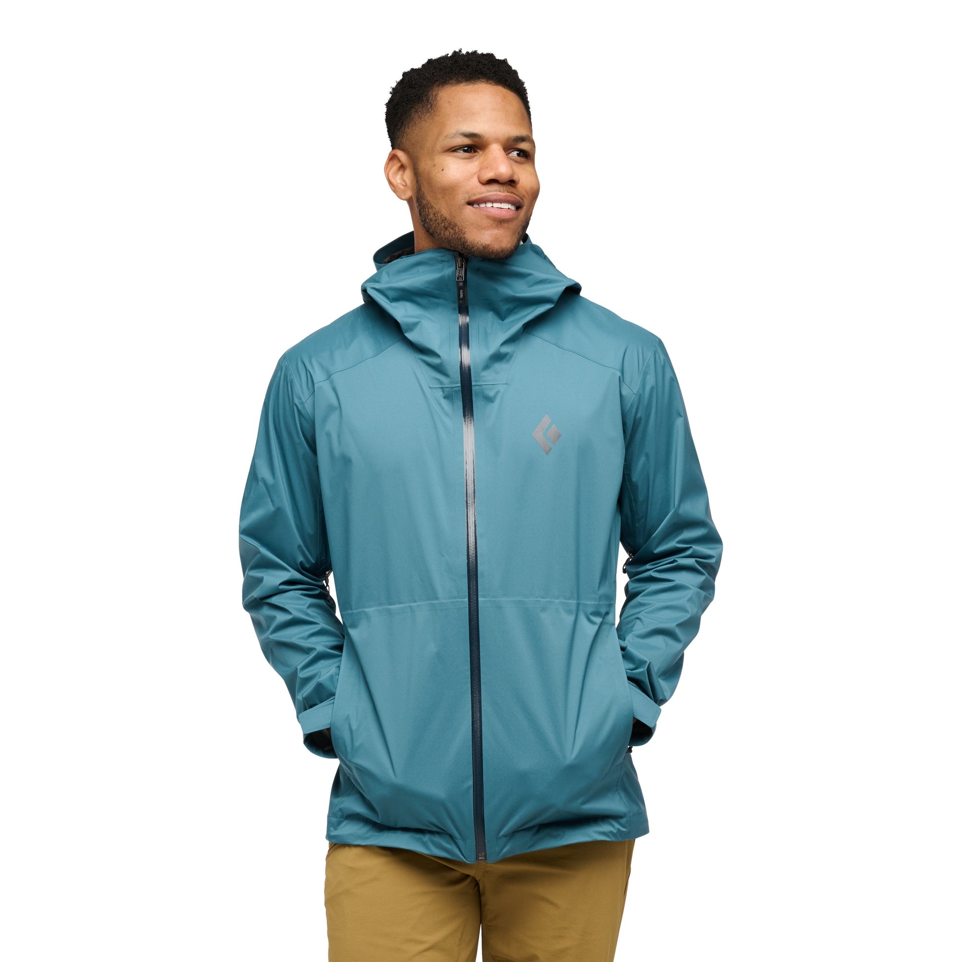 Man wearing a teal jacket on a white background