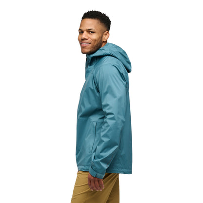Man wearing a blue raincoat on a white background