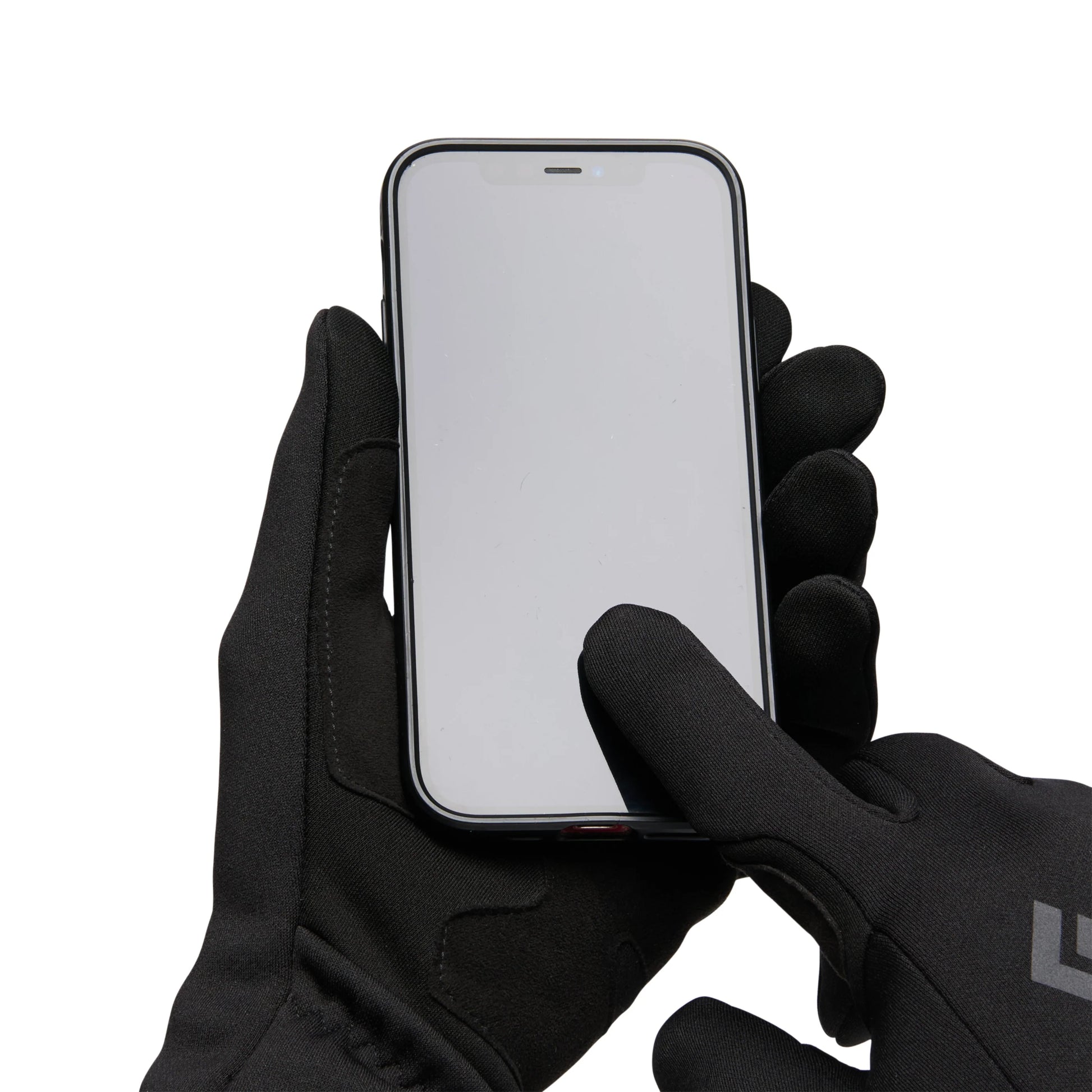 Person wearing black gloves holding a smartphone on a white background