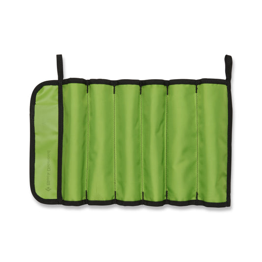 Green roll-up tool case with black trim on a white background