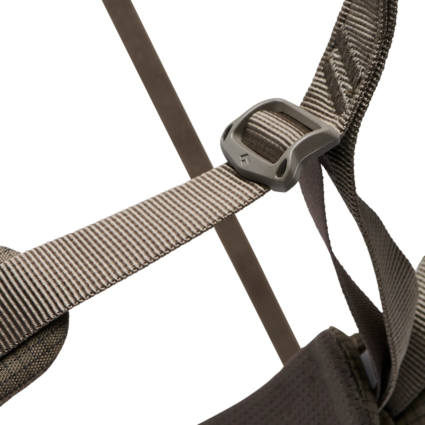 Close-up of a brown backpack strap with a buckle on a white background