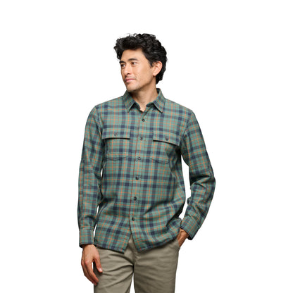 Man wearing a plaid shirt on a white background
