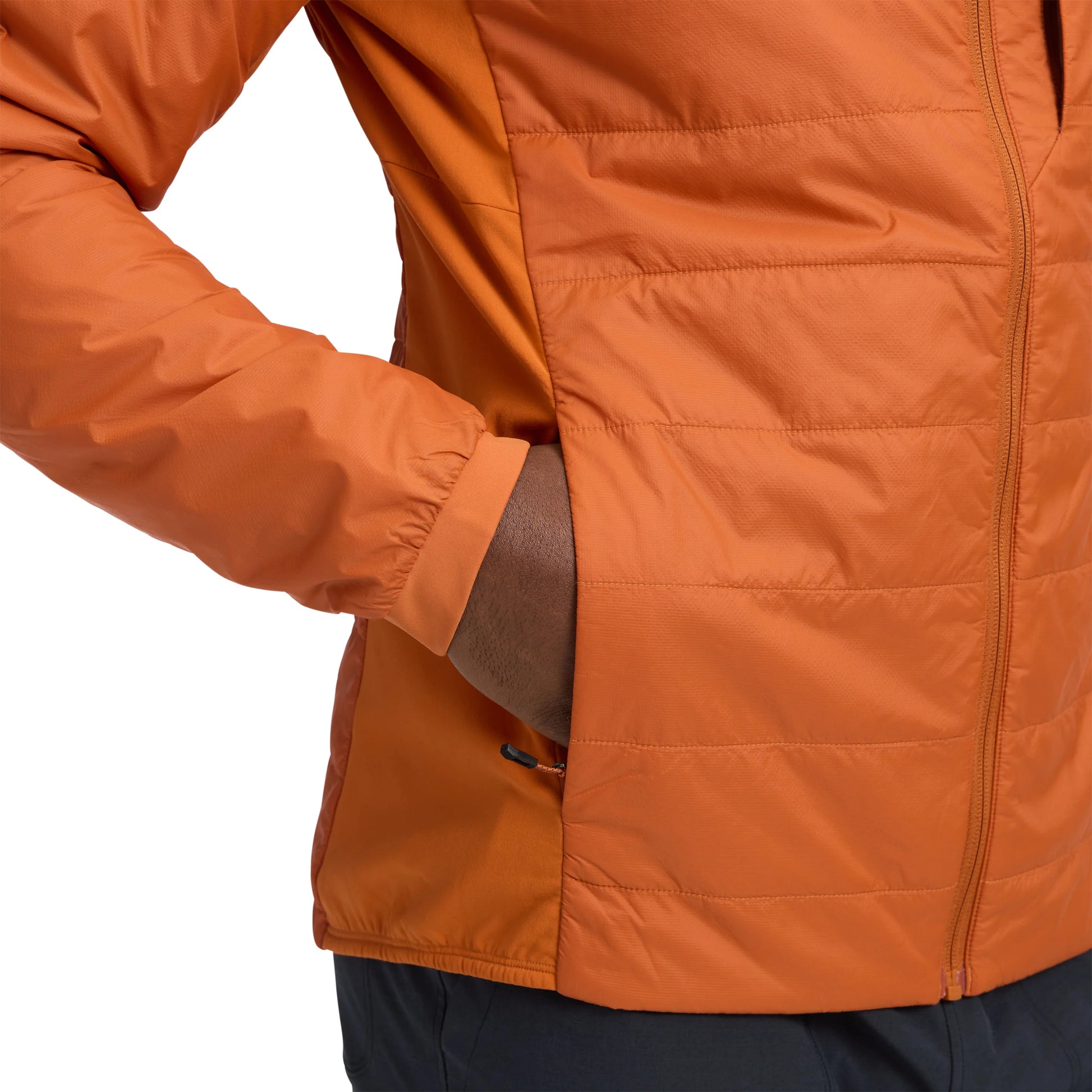 Close-up of an orange jacket with a white background