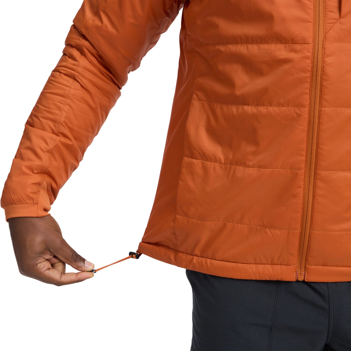 Close-up of an orange jacket with a person adjusting the zipper on a white background