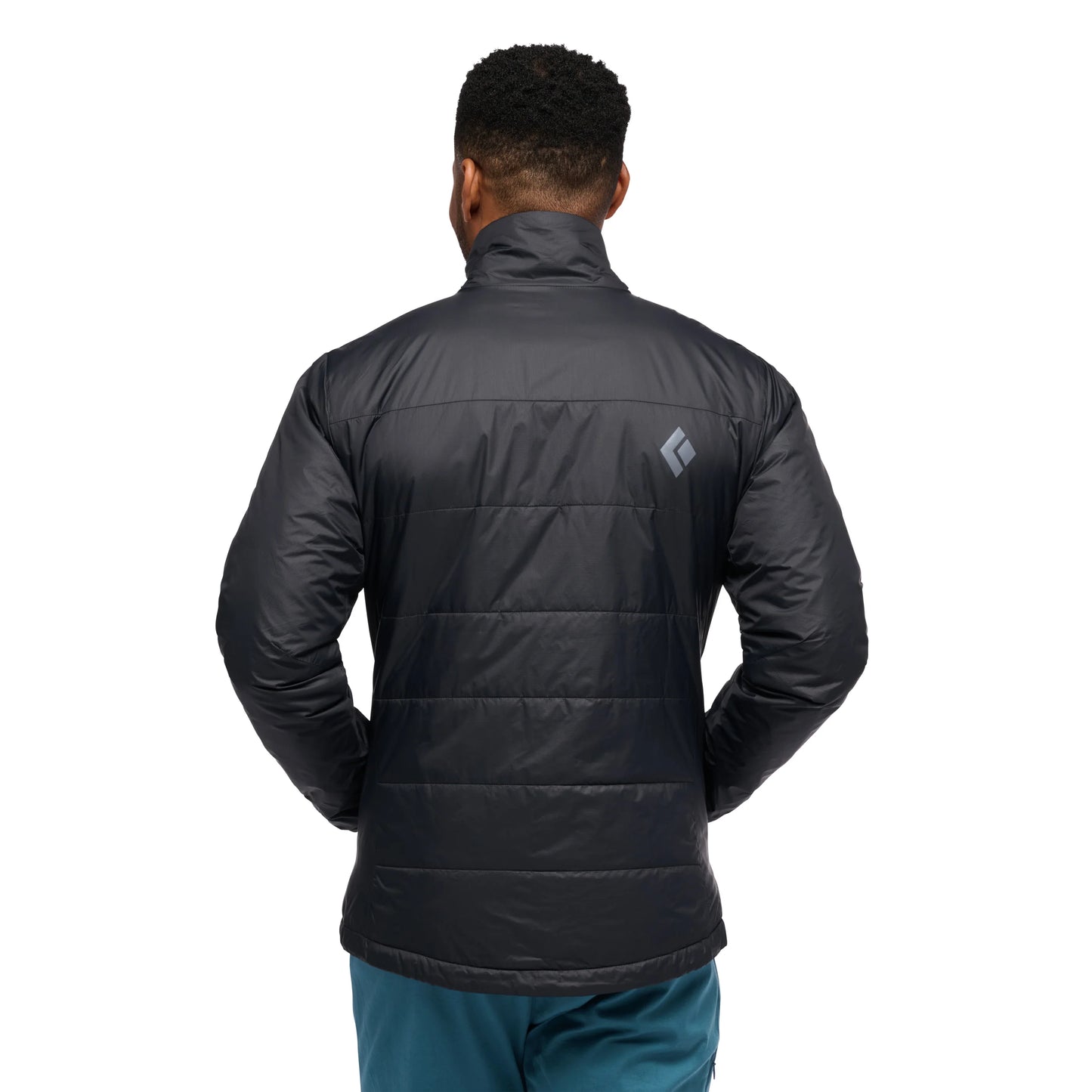 Person wearing a black puffer jacket with a visible brand logo on the back, standing against a white background.