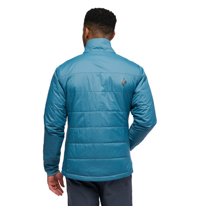 Person wearing a blue jacket on a white background