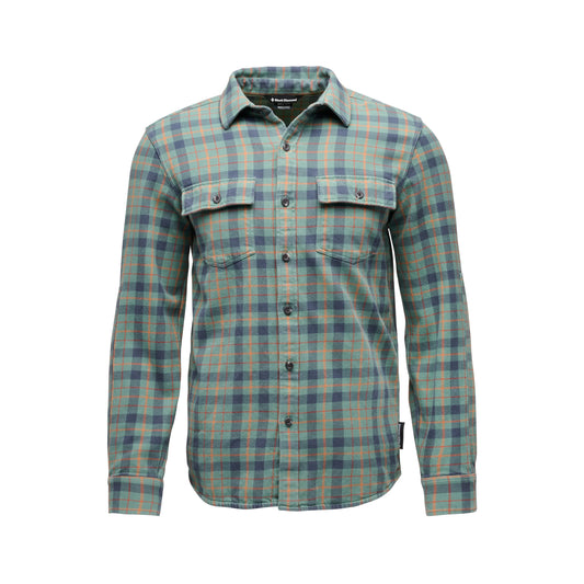 Plaid shirt with green and blue pattern on a white background