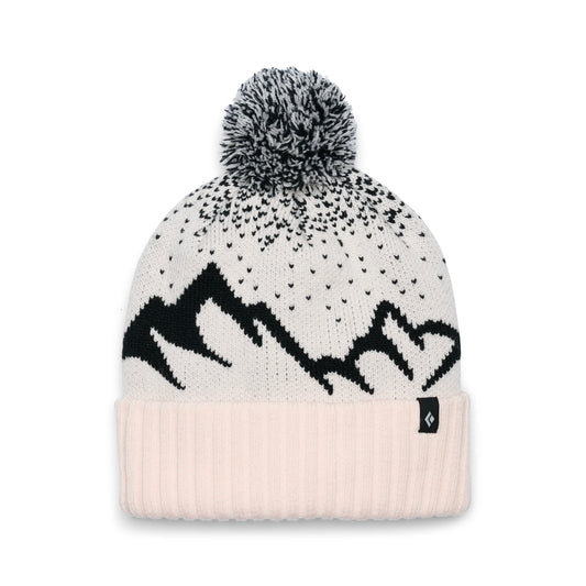 Beanie with mountain design and pom-pom on a white background
