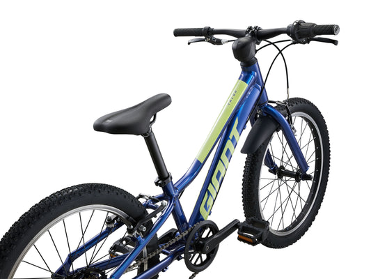 Blue children's bicycle with black seat and tires on a white background