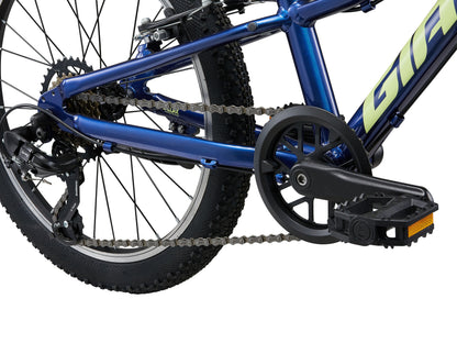 Close-up of a blue bicycle with chain and pedal on a white background