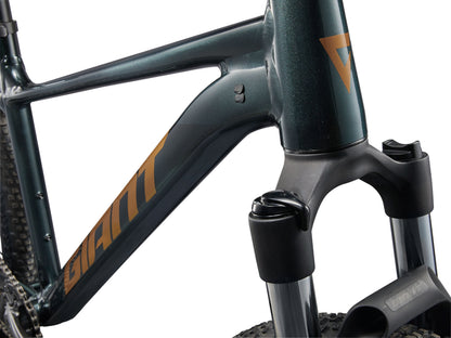 Close-up of a bicycle frame with 'Giant' branding on a white background