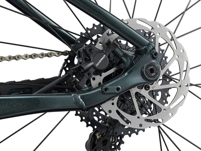 Close-up of a bicycle's gear system with a disc brake on a white background